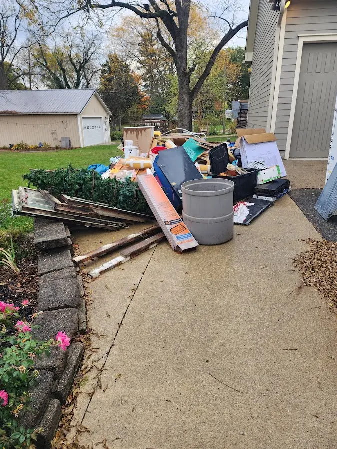 Dumpster being loaded with debris for 3 Yard Dumpster Rental in Galena Park